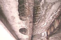 Salt and old age have eaten away concrete and supporting steel beams. bridgeclose_damage200