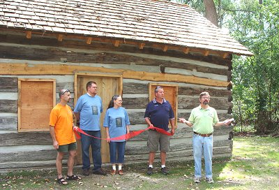 (Left to right) Carl Coté, Robert North Baldus, Jane Ellen North Bryce, Al Roy, Ed LaVigne North Log Cabin