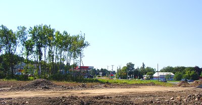 The site, at the northernmost tip of Triphammer Road, is cleared and leveled to prepare for construction grocery_clearingdirt
