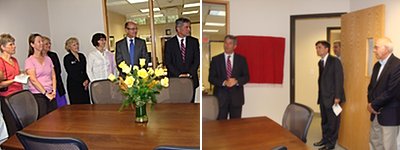 The room was lined with well wishers around a hand made table made by local craftspeople out of local wood. At right: TCAD Board of Directors Vice Chairman Gregory Hartz (left) and TCAD President Michael Stamm presented the plaque. andycomf table