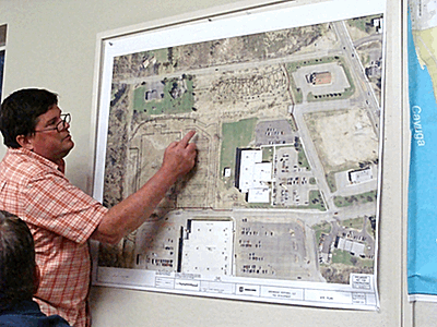 Jim Bold shows Trustees where the fueling station will be located, if approved. bj_boldfuel