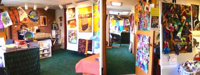 Her studio incorporates an open workspace with a gallery. At right: When Art trail visitor come to Dutko's studio she cuts pieces from her scrap bags and asks them to put a piece on a panel she has set up in her studio. She ends up with a collage filled with shapes that people cut out. She sews them together to make a banner of all the panels. Dutko has done this every year she has participated in the Art Trail. The first banner is on display at Center Ithaca. dutko_studio