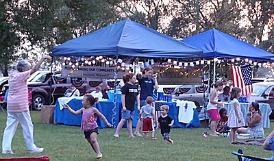 Sparklers, light-up American Flag pins, and Harbor Festival T-shirts were on sale at the Community Council tent to help support the fireworks and Harbor Festival. fw_kidsdance