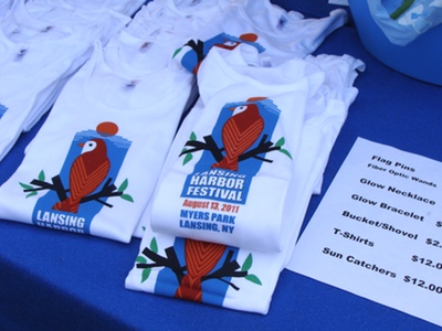 T-shirts featuring the 2001 Lansing Harbor Festival logo were on sale, and will be available at the Concert at the Park series, among other places around town. fw_tees