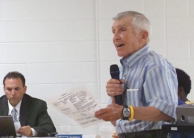 Dave Heck (standing) at Monday's school board meeting heckatschoolboard400