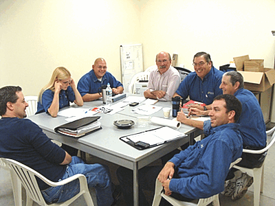 Managers met Monday morning in the break room. Clockwise from left Brian Downing, Shannon Canino, Bill Canino, Don Taylert, Jim Lauretti, Allan Bomzer, Matt Muraca lmaug_managers