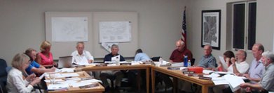 Clockwise, Planning Board member Maria Stycos, Trustee Pat O'Rourke, Codes Officer Marty Moseley, Village Clerk Jodi Dake, Mayor Donalt Hartill, Planning Board Chair Mario Tomei, Village Attorney David Dubow, Village engineer Brent Cross, Planning Board member Phil Dankert, Trustee Julie Baker, Planning Board member Richard Durst, Trustee John O'Neil, Planning Board alternate Jonathan Kanter (Trustee Lynn Leopold not shown) lr_boards