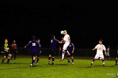 Senior tri-captain and midfielder Sean Streb’s header sails high over the Dryden goal. soccer_10dryden_streb3
