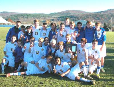The Lansing boys’ soccer team celebrates their Section IV Championship last Saturday at the Soccer Hall of Fame in Oneonta, NY soccer_20111105_group