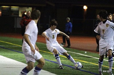 Junior striker Ethan Kutler plays a short pass to a Bobcat teammate during their 1-0 IAC Championship victory over Elmira Notre Dame. Shown at top, Senior winger Taylor Schuster looks to attack the flanks of Elmira Notre Dame in the 2011 IAC Large School Championship game on Saturday night. soccer_kutleriac2
