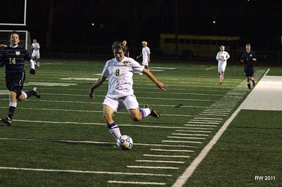 Junior striker Nathaniel McIntosh readies to unload a long range shot that clanged off the cross bar in the waning moments of the Bobcats’ victory at Ithaca High School. soccer_mcintoshiac2
