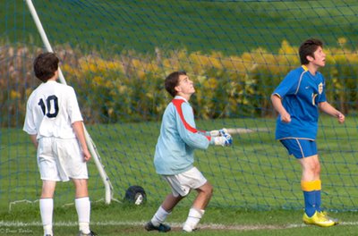 Senior striker Andy Roth awaits a cross from a teammate as the Moravia keeper looks on during the Bobcats 13-0 victory last Thursday in Moravia. soccer moraviaroth