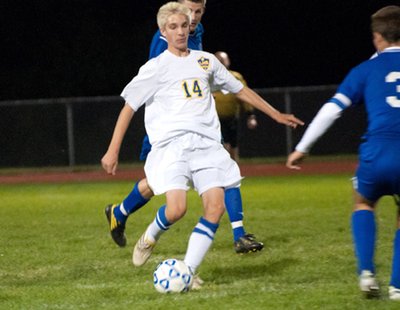 Senior winger Troy Hradisky looks to play the ball through the Trumansburg defense during Lansing’s 3-1 victory on Monday night at Lansing’s Sobus Field. soccer tburghradisky