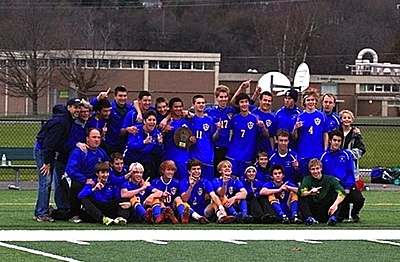 The Lansing Bobcats Boys’ soccer team celebrates their first Regional Championship since 2004 after their 1-0 victory over Tully High School soccer_tully_team