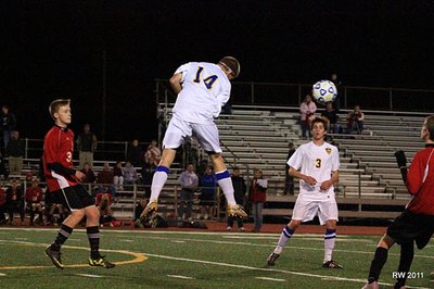 Senior midfielder Troy Hradisky goes up high to win a ball in the air on Wednesday night. soccersve_4_400