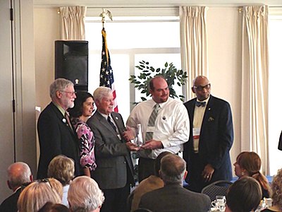 Russ Givens accepting Corporate Philanthropist of the Year Award afp_cargill