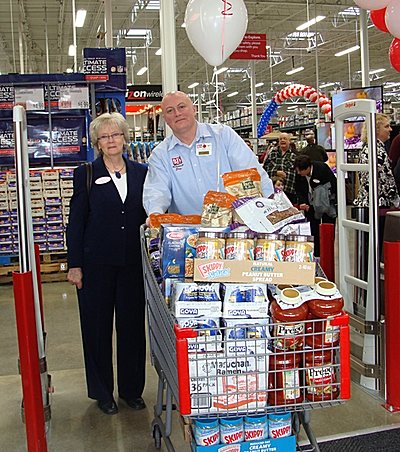 Lansing Food Pantry Director Nancy Myers recieved a cart full of food for her program. bjopening_myers