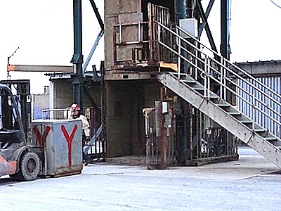 The elevator in Shaft #3 has a lowe section about 7 feet high, and an upper compartment around 25 feet tall that allows equipment up to 22 feet to be lowered into the mine. In this picture a large crate is being loaded into the lower section. cargillshaft_loading