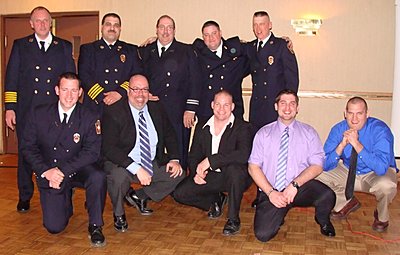 Top row, left to right: Chief Scott Purcell, Deputy Chief Brad George, 1st Assistant Chief Dennis Griffin, 2nd Assistant Chief Mike Drake, 3rd Assistant Chief Jim Myers; Bottom row: Lieutenant Darin Buck, Lieutenant Jason Berga, Lieutenant Tom Smith, Lieutenant Dan Pine, Captain Scott Walters. firebanq_swearingin