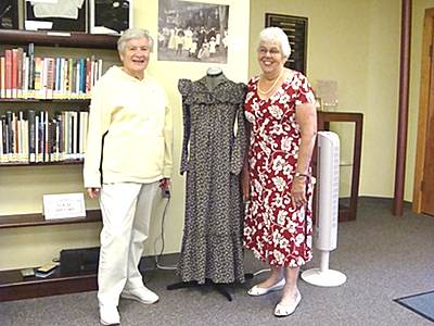 Louise Bement (left) and Fannie Welch with a maternity dress from the late 1800s histclothing_louisefannie