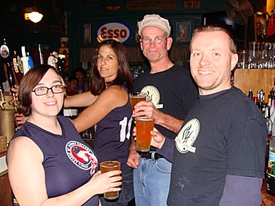 Meeting, greeting, and celebrity bar tending (left to right) BlueStockings skaters Cello Sullivan (aka Armagayddon), Christa Shopis (aka Killah Watts), Rogues' Harbor Brewing Company Brewer Chris Williams, and Assistant Brewer Alex Schwartz rollerbeer_behindthebar