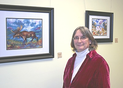 Robin Schuttenberg at the opening of a show of her own work at the Lansing Community Library, running through the end of March. Photo by Monroe Payne schuttenberg_moose
