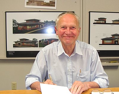 Village of Lansing Mayor Donald Hartill in front of plans for a new village office villagehall_hartill
