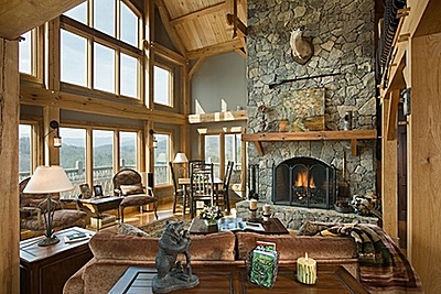 Passive solar energy utilizes expansive windows to allow natural sunlight to shine through - Photos provided by Woodhouse, the Timber Frame Company of Mansfield, Pennsylvania woodhouse400