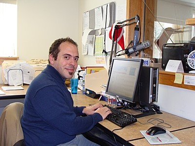 Greg Fry writing copy in the newsroom fry_newsroom