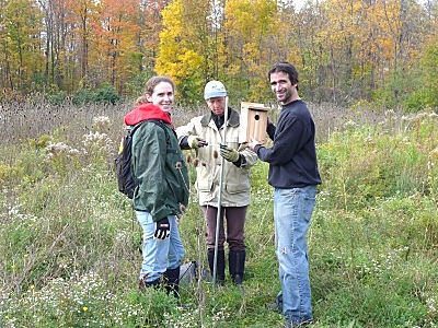 Robyn Bailey, Susan Ruoff andPaul Paradine installing a nest box at Lansing Center Trail (Photo by Suan Yong) nestbox_robyn_bailey_susan_ruoff_paul_paradine_lansing_center_trail_by_suan_yong