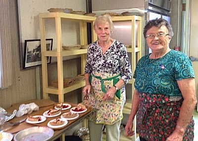 Ethel Cratsley (left) and Laura Green preparing pies for Election Day supper nlads_cratsleygreen