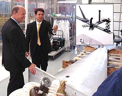 Alex Deyhim (right) tells Tom Reed about an experimental radar test range that is being constructed in the Lansing facility for NASA, which will use it to test stealth technology adc_nasarig