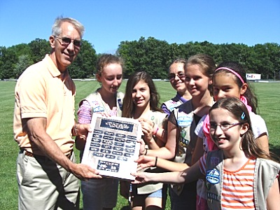 Parks and Rec Superintendent Steve Colt is presented with a plaque listing the girl scouts and donors to the project bgbrrc_plaque