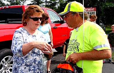Connie Wilcox presents two checks for the Food Bank of the Southern Tier's Backpack Program™ ca_connie