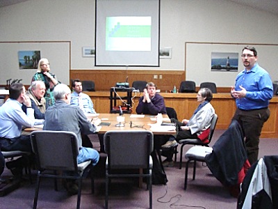 From Left, then counterclockwise around the table: RFP Committee Chairman Daniel Adinolfi (standing), Deborah Trumbull, Better Housing For Tompkins County's Rick Cowan, Hunt Engineers and Architects Ben Gustafson, Calimar Director of Senior Housing Development Jocelyn Bos (standing), Gerald Caward, Town Councilman Robert Cree, Town Planner Jonathan Kantor calimar_presentation