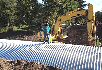 Councilman Ed LaVigne standing on top of the Triphammer terrace culvert. (Photo courtesy of Ed LaVigne) culvert_lavigne