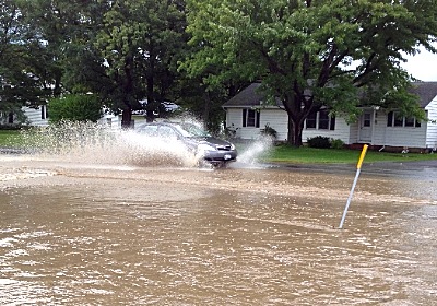 Auburn Road near the Lansing Library made for spectacular splashes in yesterday's flooding (photo by Karen Veaner) flood_ridgeroad2