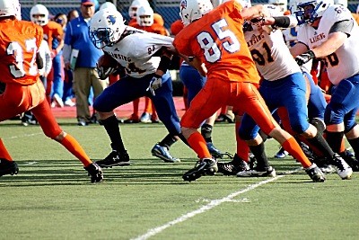 #84 Austin Edwards pushing his way through the Spartan defense for a first down football 1015H