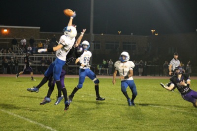 Lansing's Cornerback, #12, Zack Detrick denies the pass from Dryden’s QB, #10, Trevor Gardner. All Photos by Lynn Benedetto football detrick