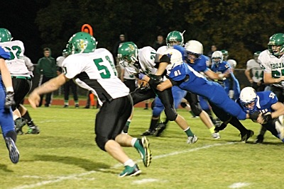 Lansing's Defensive End, # 81, Logan Osterman, bringing down one of Greene's Horsemen football lg-tackle