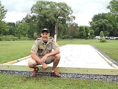 Joe Koch in front of the Bocce field in Myers Park that was built under his leadership joekoch_bocce_ball_court