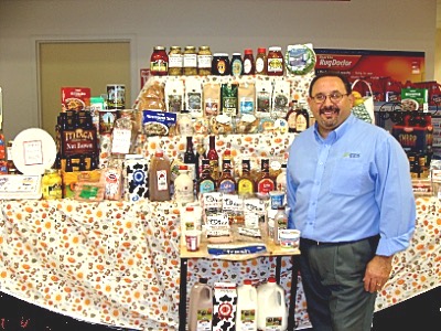 Manager Sandro Mironti with a large selection of locally produced products that are sold at Lansing Market lmlocal sandro