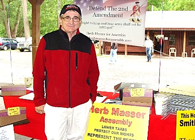 Masser at last year's Lansing Rod & Gun Club Sportsman Show. Among his fundraising efforts, Masser hand crafts tables from stone slabs from local gorges to sell to supporters. lrgss herbmasser