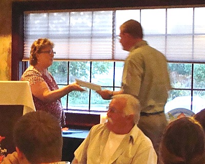 North Lansing Auxhiliary Treasurer Connie Wilcox presented certificates for community service nlx_conniekevin