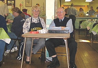 Ray Buckley with Noni Krom, selling pancake breakfast tickets in the Lansing Community Center rcb 2005 400