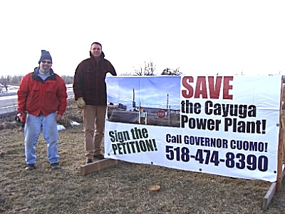 Lansing Councilman Ed LaVigne (left) and Tompkins County Legislator Mike Sigler erected eight signs around Lansing Wednesday to get people to support repowering the Cayuga Power Plant. siglersigns_edmike400