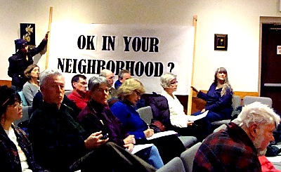 The Laux family brought a 32 square foot sign to Wednesday's Town Board meeting to illustrate why the maximum size would be too big in a residential neighborhood sign_size