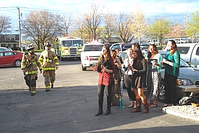 Lansing Firefighters respond to a fire alarm at the Town hall Friday. Cornell A Capella Singers perform at right. esfota2015 0246