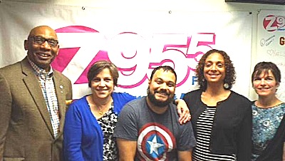 Left to right- James Brown and Meg Cole, United Way; Gabe Carrillo, Cayuga Radio Group; Samantha Little, Principal, South Hill Elementary School; Maureen Gilroy, Librarian, Enfield Elementary School. Photo courtesy of Cayuga Radio Group cans 400