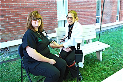 Kelli Hektor, RPA-C of Ithaca Primary Care checks a patient's blood pressure Blood Pressure